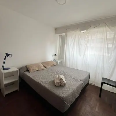 a bedroom with a bed with a stuffed animal on it at Pueyrredon 40, Nueva Cordoba in Cordoba