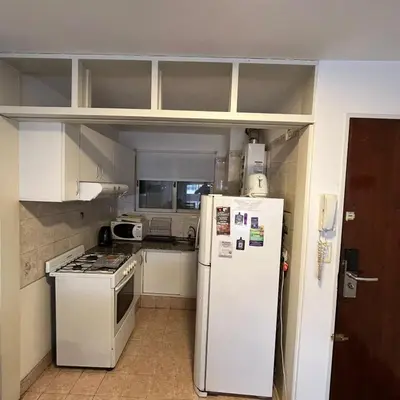 a kitchen with a refrigerator and a stove at Pueyrredon 40, Nueva Cordoba in Cordoba