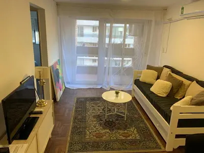 a living room with a couch and a table at Pueyrredon 40, Nueva Cordoba in Cordoba