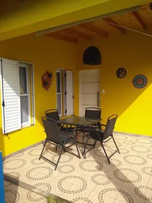 a dining room with a table and chairs at Cabañas Tierra del Sol in Las Rabonas