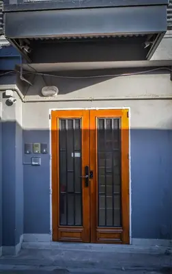 a pair of doors on the side of a building at Dpto s/av Rafael Nuñez - 1 dorm y balcon in Cordoba