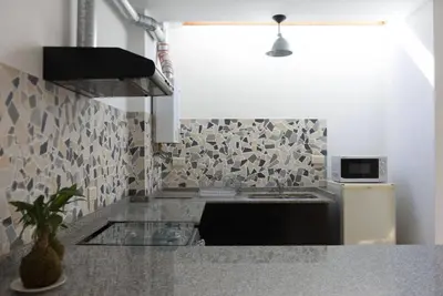 a kitchen with a sink and a counter top at RELÁJATE Y DISFRUTA DE LA MEJOR ZONA DE CORDOBA. in Cordoba