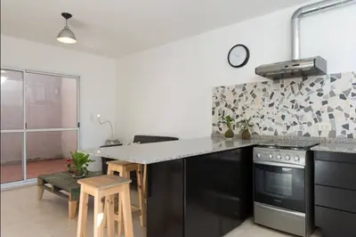 a kitchen with a stove and a counter top at RELÁJATE Y DISFRUTA DE LA MEJOR ZONA DE CORDOBA. in Cordoba