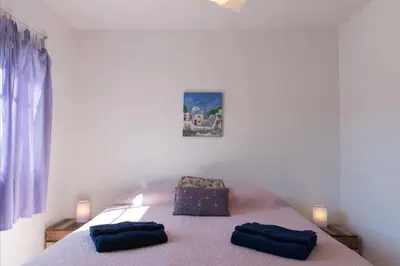 a bedroom with a bed with two pillows on it at RELÁJATE Y DISFRUTA DE LA MEJOR ZONA DE CORDOBA. in Cordoba