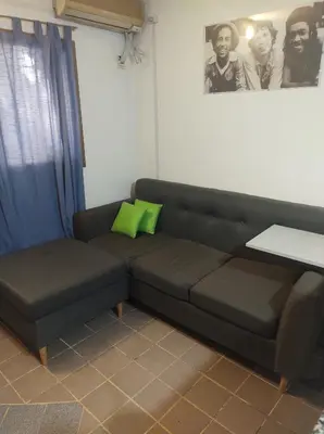 a living room with a couch and a table at Lunita de Alberdi in Cordoba