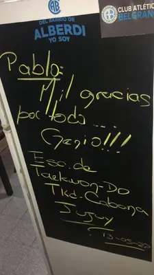 a chalkboard sign with writing on it at Lunita de Alberdi in Cordoba