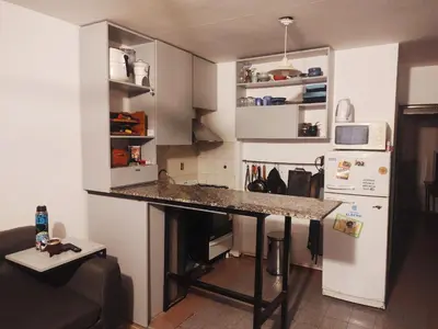 a kitchen with a counter top in a room at Lunita de Alberdi in Cordoba