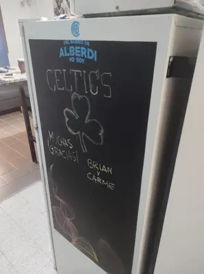 a chalkboard sign for a restaurant with a clover on it at Lunita de Alberdi in Cordoba