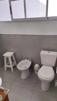 a bathroom with a toilet and a sink at Depto en la Sierra!! Barrio Villa del Lago con vista a los Gigantes in Villa Carlos Paz