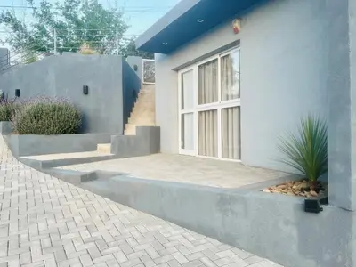 a house with steps leading up to a window at Depto en la Sierra!! Barrio Villa del Lago con vista a los Gigantes in Villa Carlos Paz