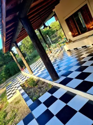 a view of a porch with a black and white checkered floor at las brisas casas de campo un lugar para soñar in San Antonio de Arredondo