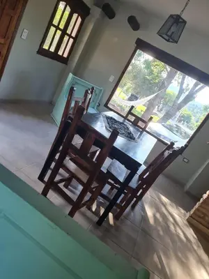 a wooden chair sitting on top of a table at las brisas casas de campo un lugar para soñar in San Antonio de Arredondo