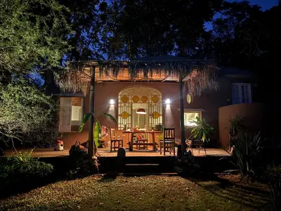 a house with a front door at night at casa cupulas in Cordoba