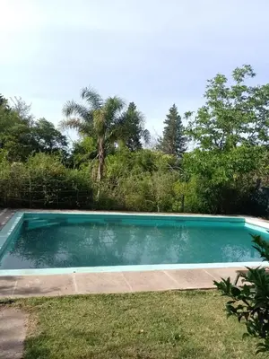 a swimming pool in the yard of a house at casa cupulas in Cordoba