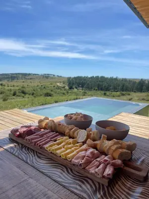 a tray of different types of food on a table at Cabaña La Alemana in Villa Berna