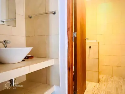 a bathroom with a white sink and a shower at Lofts en la Sierra!! Excelente vista a los Gigantes in Villa Carlos Paz