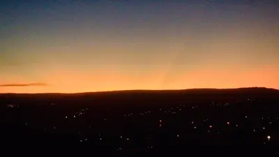 a sunset over a city with the sky at Lofts en la Sierra!! Excelente vista a los Gigantes in Villa Carlos Paz