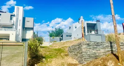 a building with a fence in front of it at Lofts en la Sierra!! Excelente vista a los Gigantes in Villa Carlos Paz
