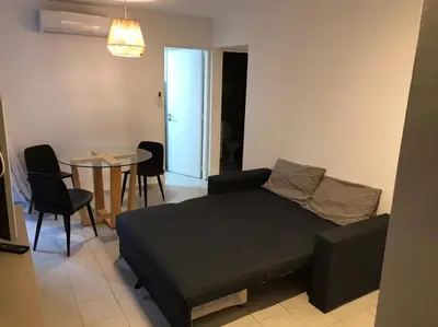 a bedroom with a bed and a table and chairs at AYACUCHO APART. in Cordoba