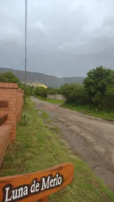 a sign on the side of a dirt road at LUNA DE MERLO in Merlo