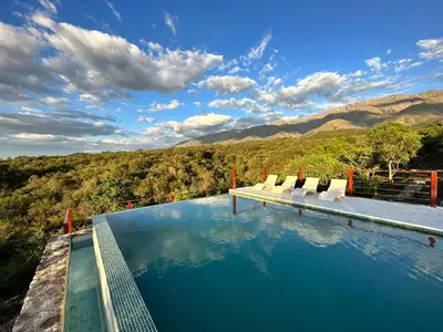 a swimming pool with a view of the mountains at ACHIRAS SUNSET in San Javier