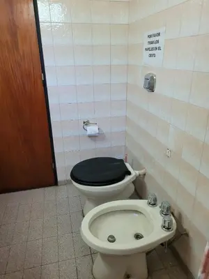 a bathroom with a toilet and a sink at El Remanso Estadia Minima 2 Noches in Cordoba