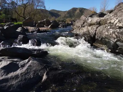 a river with rapids on the rocks at Alojamiento entre rios y montañas in Villa Carlos Paz