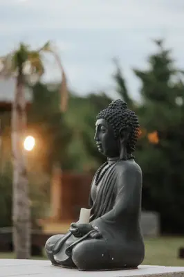a statue of a woman sitting on the ground at OMM Suites Resort, Villa General Belgrano in Villa General Belgrano