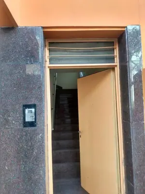a door leading up to a stairwell with a stair case at Ser Uno in Cordoba