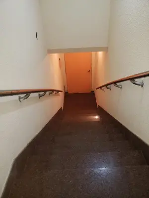 an empty hallway with empty racks in a room at Ser Uno in Cordoba