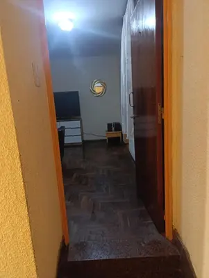 a hallway with an open door to a room at Ser Uno in Cordoba