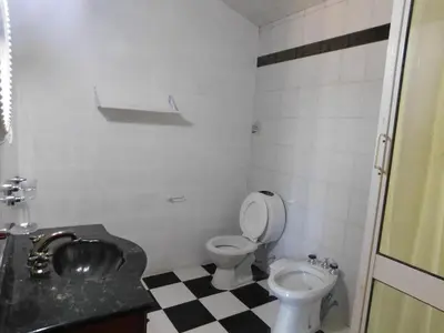 a bathroom with a toilet and a sink at Filipao Aparts in Santa Rosa de Calamuchita