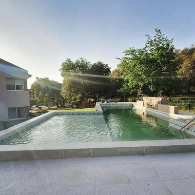 a pool of water in the middle of a building at COSTA COM Cabañas in Merlo