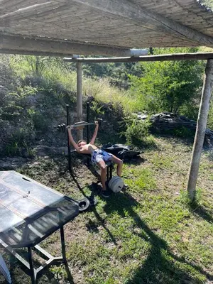 a young boy is playing on a swing at CABAÑAS CAMPO CHICO in Trapiche