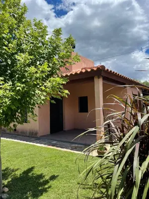a house with a grass yard in front of it at Cabañas Samarana in Carpintería