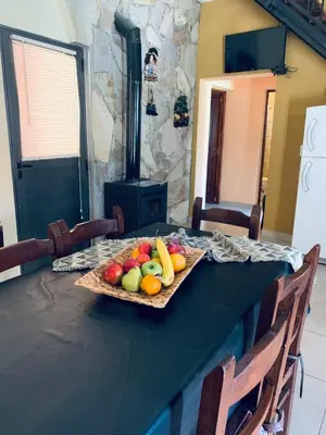 a table with a tray of fruit on it at Cabañas Samarana in Carpintería