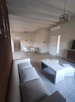 a living room with a couch and a table at Casa Etor in Merlo