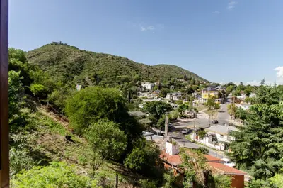 a town on a hill with a mountain at del Buen Ayre in Villa Carlos Paz