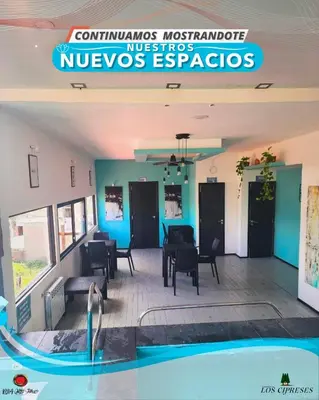 a view of a lobby with a swimming pool at Complejo Los Cipreses in Villa Carlos Paz