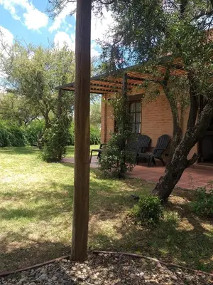 a wooden pole in a yard with a house at Altos de San Blas in San Javier