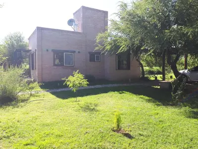a house with a grass yard in front of it at Altos de San Blas in San Javier
