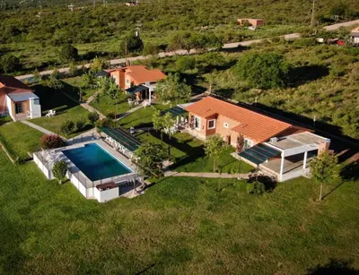 an aerial view of a house with a swimming pool at Aiken Cabañas in Villa Cura Brochero