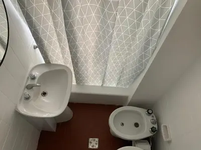 a small bathroom with a sink and a toilet at Chile 210, Nueva Cordoba in Cordoba