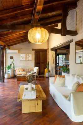 a living room with a white couch and a table at Gardenia Select in San Javier