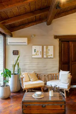a living room with a couch and a table at Gardenia Select in San Javier