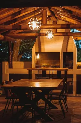 a dining room with a table and a fireplace at Gardenia Select in San Javier