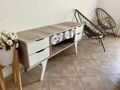 a coffee table with plates on it in a room at Depto 8 - Villa Carlos Paz in Villa Carlos Paz