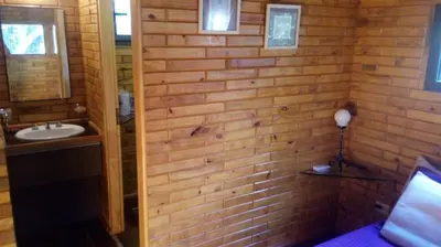 a bathroom with a sink and a mirror at Cabañas El Druida in Villa General Belgrano