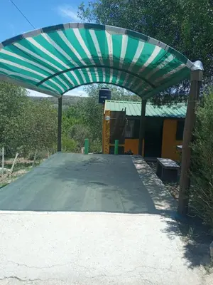 a green and white canopy over a tennis court at Casa de alquiler 2 in Tanti