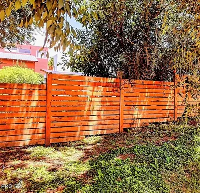 an orange fence in front of a house at Cabaña Los Algarrobos in Villa Icho Cruz